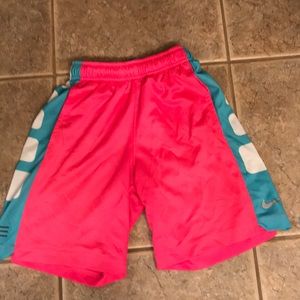 nike bright pink and neon blue basketball shorts.